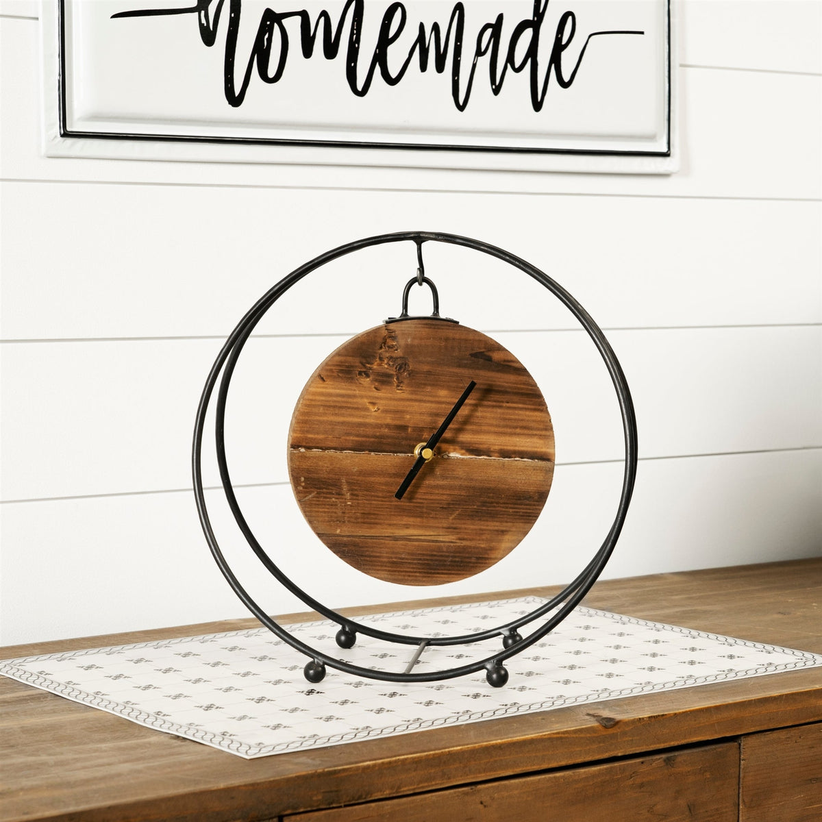 Natural wooden hanging clock in round metal stand 11.5"d