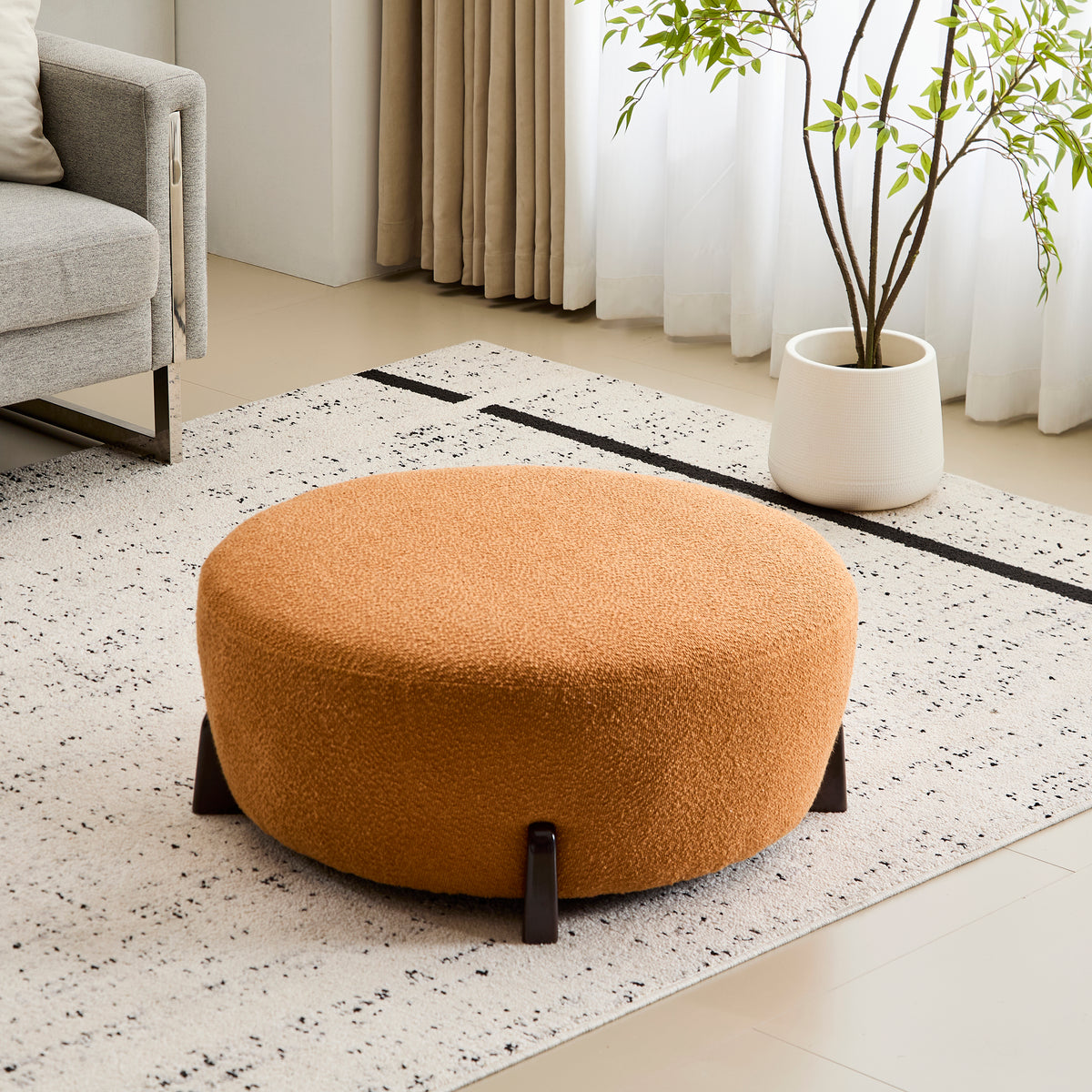 Modish Round Ottoman: Boucle Top with Splayed Rubber Wood Legs, Pumpkin
