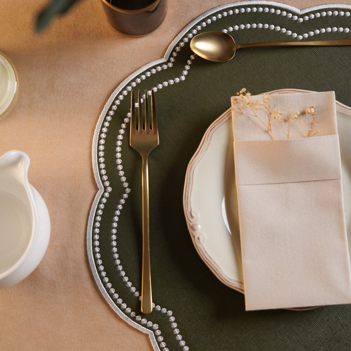 NURTURE GREEN SCALLOPED FAUX LEATHER PLACEMAT