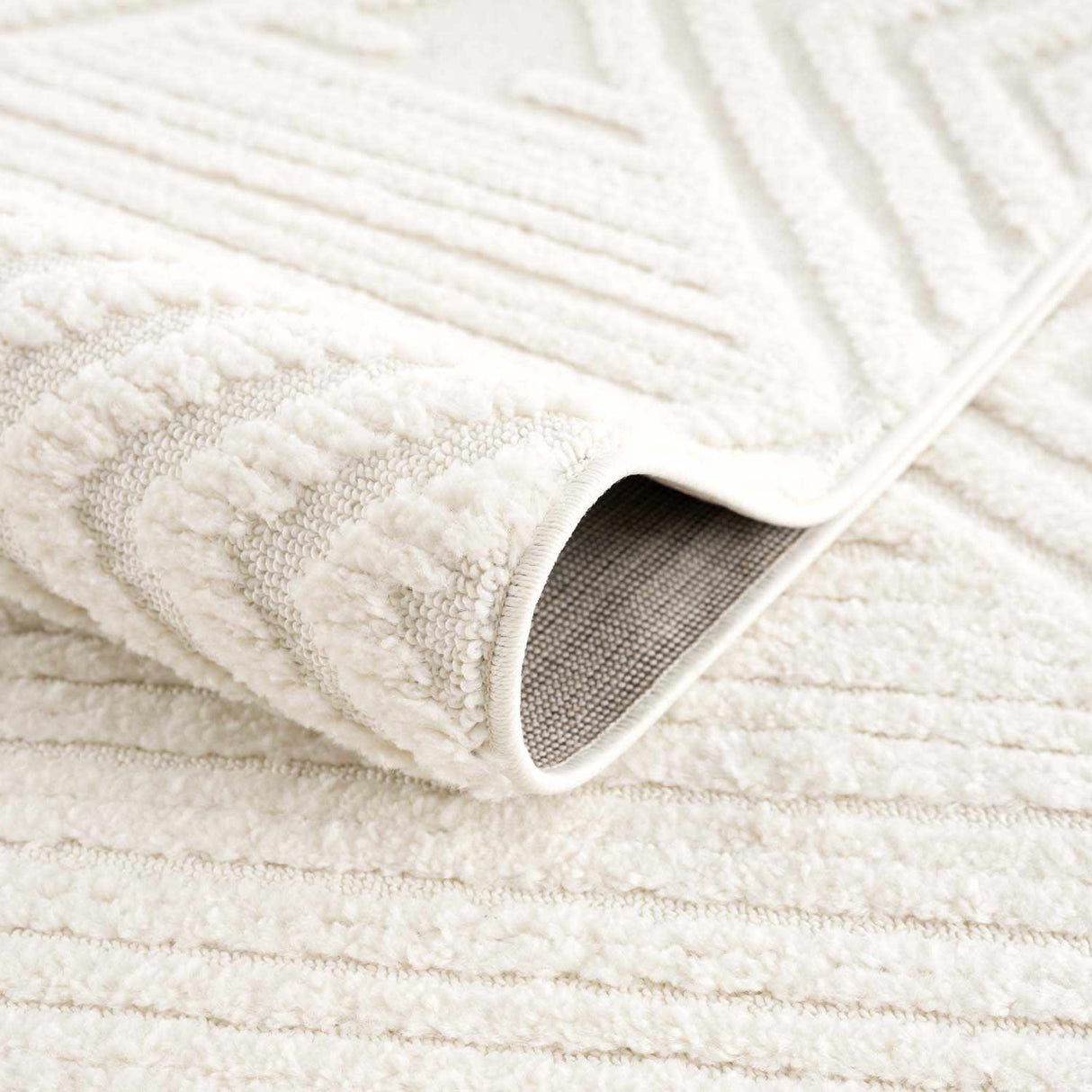 Manyas 3D Bone Area Rug with Tassels