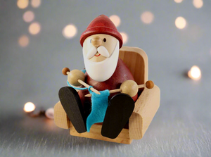 Weihnachtsmann Collectibles - Santa Knitting in Armchair
