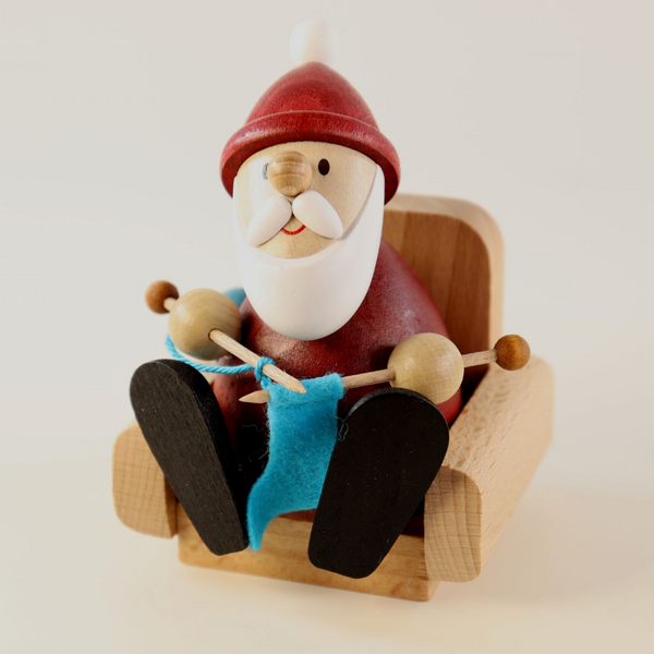 Weihnachtsmann Collectibles - Santa Knitting in Armchair