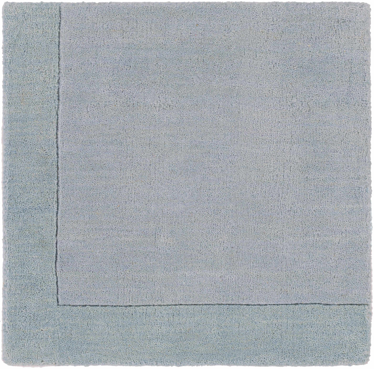 Arkabutla Solid Blue Bordered Wool Rug