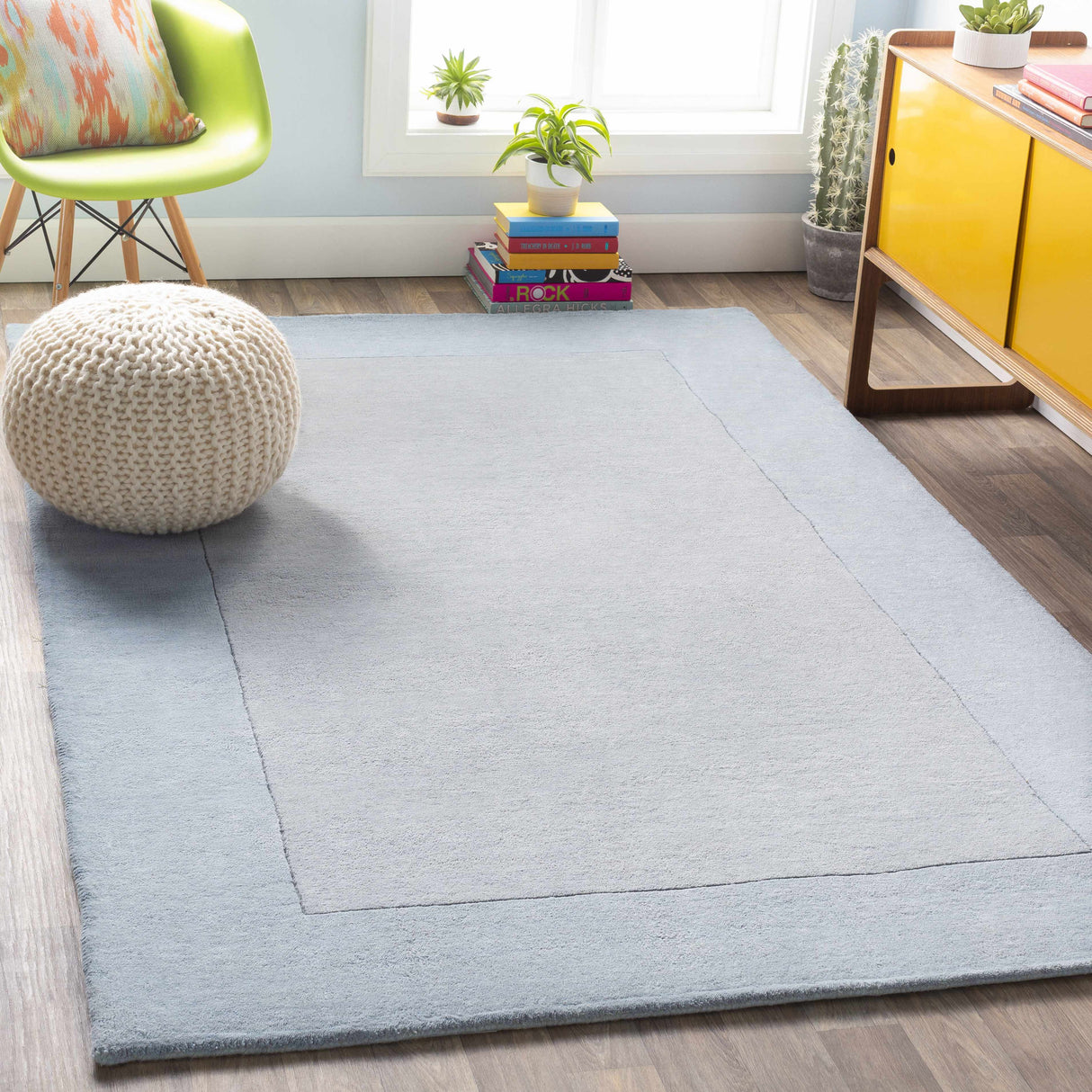 Arkabutla Solid Blue Bordered Wool Rug