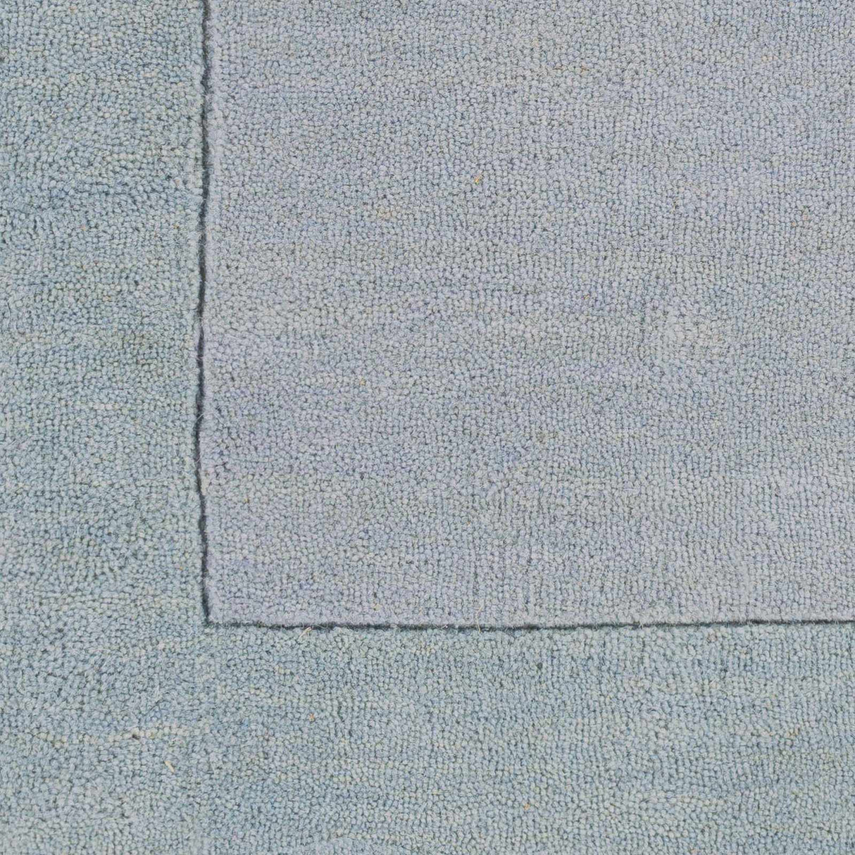Arkabutla Solid Blue Bordered Wool Rug